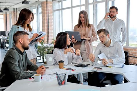 Premium Photo | Business people working as team in modern office ...