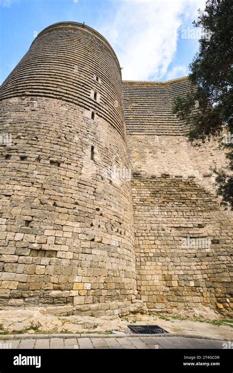 A view of the tall, round, circular, stone Maiden Tower, Qız Qalası ...