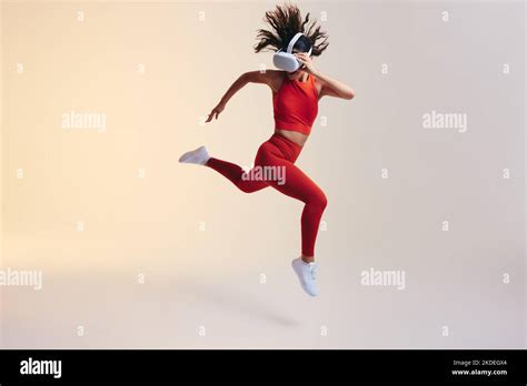 Happy Young Woman Having Fun While Working Out With 3d Technology