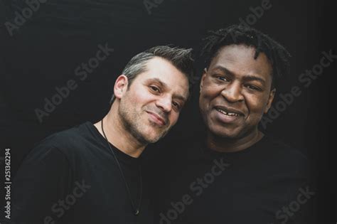 An Interracial Gay Couple Pose Before The Camera To Have Their Pictures Taken Black Man And