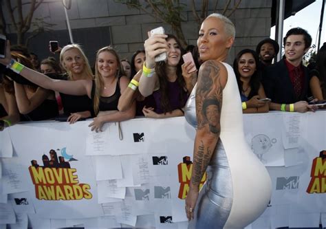 Amber Rose Flashes Assets In Low Cut Dress Bonds With Son Sebastian Ibtimes