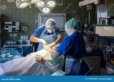 2 Young Doctors Perform An Operation In An Operating Theatre Editorial