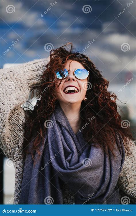 Young Beautiful Woman Wearing Sunglasses Outdoors And Smiling Urban