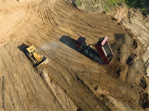 Bulldozer At Mine Reclamation Once Mining Sand Is Completed Land