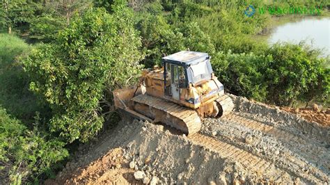 New Project Komatsu Bulldozer Clearing Spreading Red Gravel Building