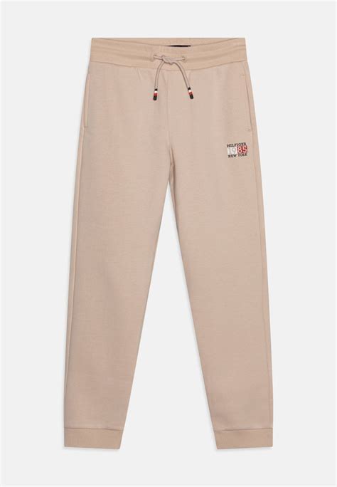 Tommy Hilfiger New York Flag Graphic Tracksuit Bottoms Cremenude