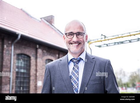 Mature Businessman Smiling Portrait Stock Photo Alamy