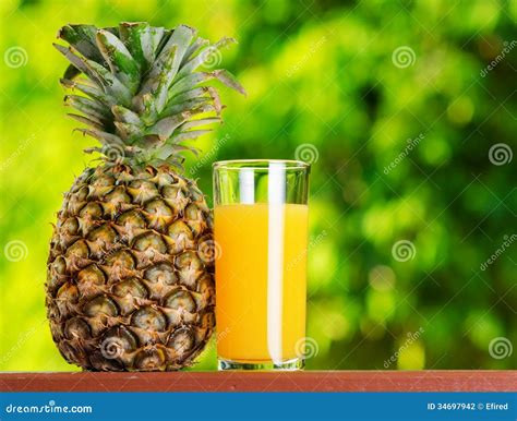 Glass Of Pineapple Juice In A Garden Stock Photography Image