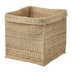 A Large Woven Basket With Handles On The Bottom Is Shown In Light Brown