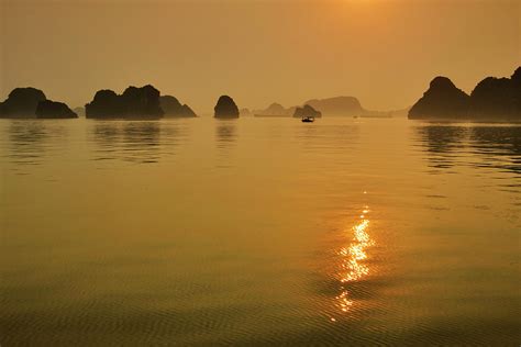 Halong Bay Sunrise Photograph by Rob Hemphill - Fine Art America