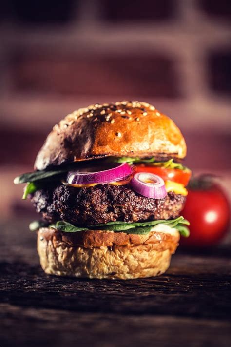 Tasty Beef Burger With Spinach Leaves Salad Onion Tomato And Cheese