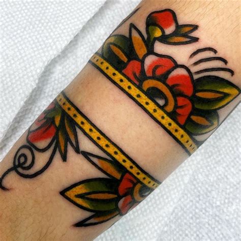 Pin by Danielle Cain on Tattoo | Traditional tattoo cuff, Flower wrist ...