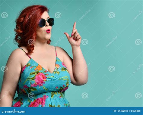 Plus Size Overweight Lady In Sunglasses And Sundress Point Her Finger Up Like She Has Got An