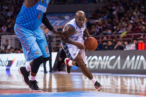 Stephon Marbury of Beijing Ducks drives the ball during the Chinese ...