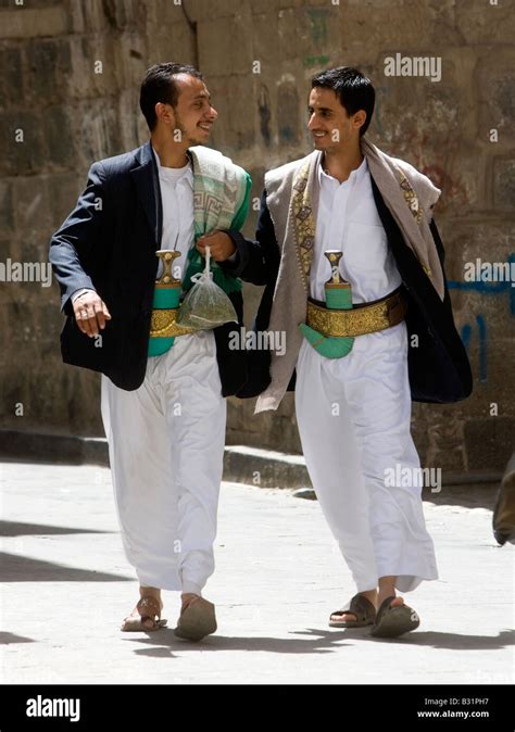 Young Muslim men from Yemen walking through Old Sanaa City wearing ...