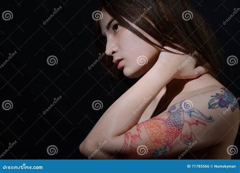 Beautiful Asian Woman With A Tattoo On Her Arm And Shoulder Dark