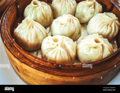 Steamed Dumplings In Wooden Basket Stock Photo Alamy