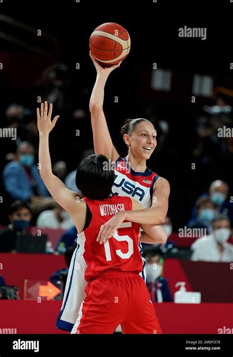 United States' Diana Taurasi (12) passes over Japan's Nako Motohashi ...