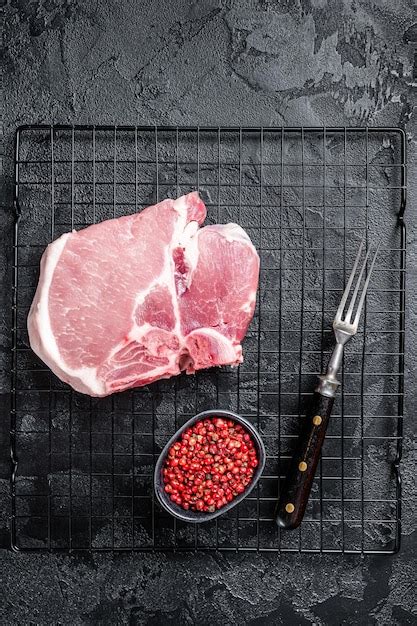 Premium Photo Uncooked Raw Pork T Bone Chop Meat Steak On Grill Black