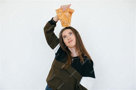 Premium Photo Young Beautiful Woman Eat Slice Of Pepperoni Pizza