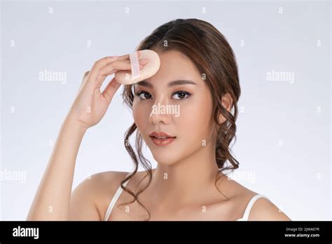 Face Make Up Concept Portrait Of Gorgeous Young Girl Applying Dry