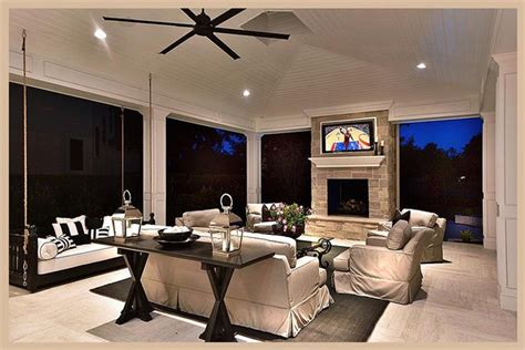 A Living Room Filled With Furniture And A Flat Screen Tv Mounted To The