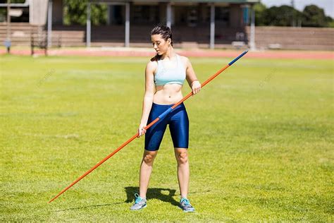 Female Athlete Holding A Javelin In Stadium Strength Javelin Skill