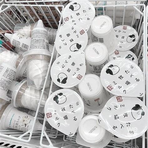 A Shopping Cart Filled With Lots Of White Dishes