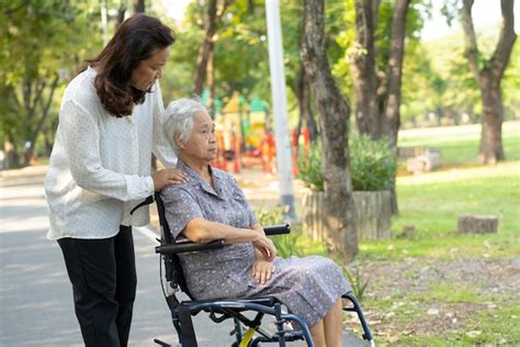 Premium Photo Caregiver Help And Care Asian Senior Woman Patient