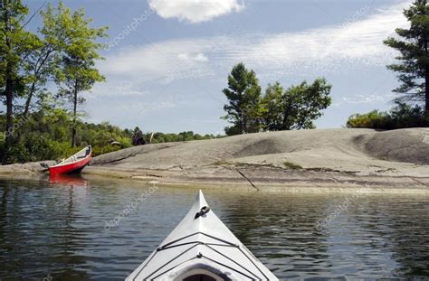 Kayak And Canoe On The Lake Stock Photo By ©gordo25 23300358