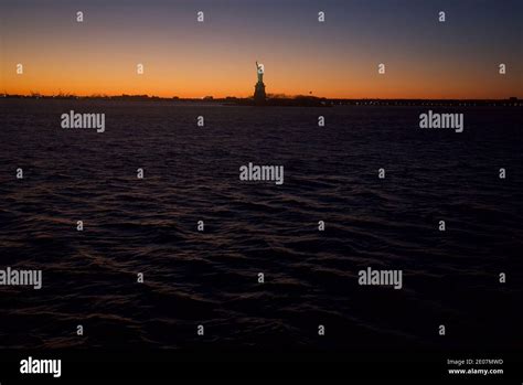 Sunset view of Statue of Liberty, New York City Statue, Liberty Island ...