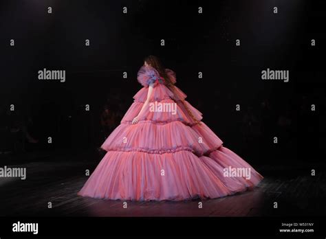 A model displays a new creation at the Viktor&Rolf (Viktor and Rolf ...