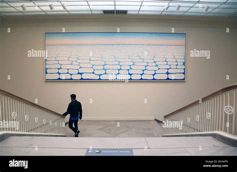 A Visitor Walking Pass By Georgia O Keeffe S Sky Above Clouds Iv