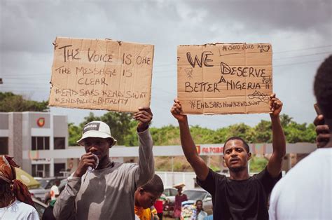 Two Male Protesters Holding Signs · Free Stock Photo