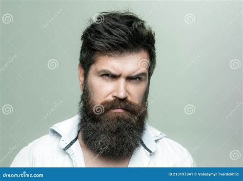 Man With Long Beard Mustache And Stylish Hair Light Background Macho On Strict Face Wears