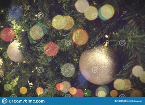 Christmas Background Of De Focused Lights With Decorated Tree Stock