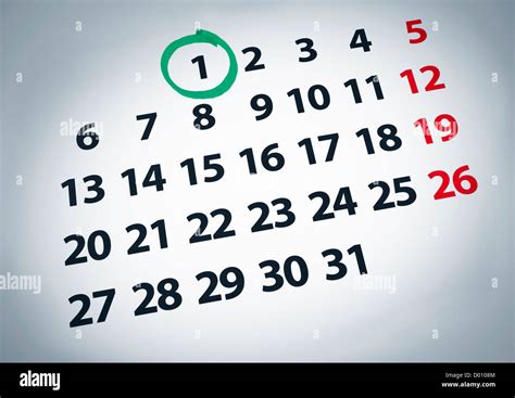 A Date Circled On A 1st Day Of A Calendar With Green Ink Stock Photo