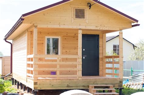 Premium Photo Cottage Identical Houses Made Of Wooden Beams Cottage