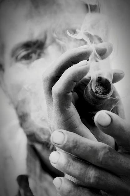 Premium Photo Close Up Of Man Smoking Cigarette