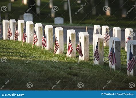 Grave Markers With Flags At Arlington National Cemetery On Memorial Day