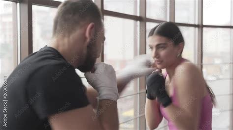 Male And Female Boxers Train In The Gym They Do Jab Punches And