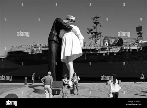 Uss Midway On The Waterfront In San Diego And Statue Of Sailor Kissing Girl At The End Of World