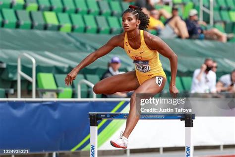 Anna Cockrell of the USC Trojans competes in the 400 meter hurdles... News Photo - Getty Images