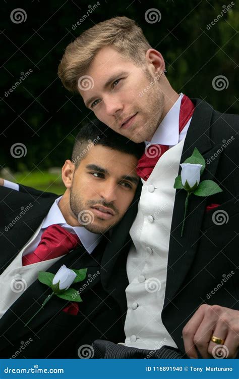 Gay Weddings Grooms Couples Pose For Pictures After Their Wedding Ceremony In Churchyard