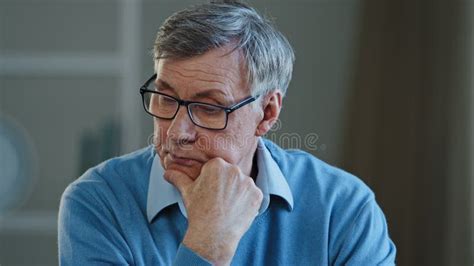 Unhappy Aged Woman Looking In Mirror At Home Touching Her Face Aging