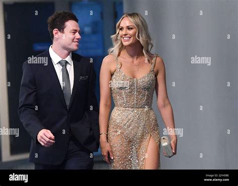 Lachie Neale Of The Lions And His Wife Julie Neale Are Seen Arriving