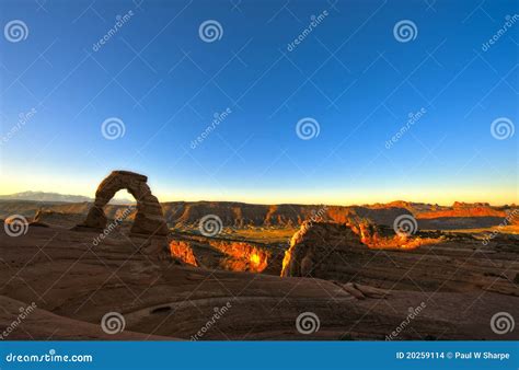 Delicate Arch at Sunrise stock photo. Image of golden - 20259114