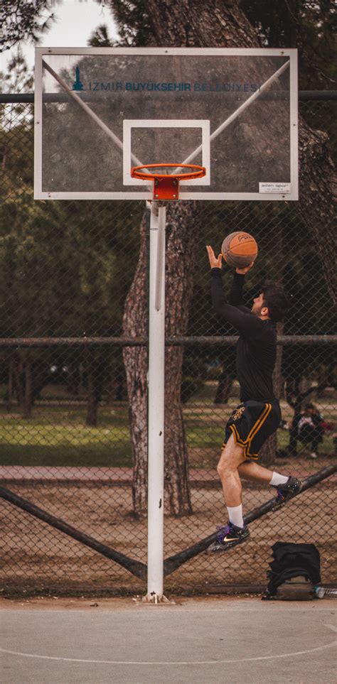 Man Throwing Basketball Ball · Free Stock Photo