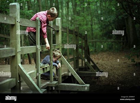 On Its The 75 Anniversary Two Children Play Pooh Sticks On Pooh Bridge