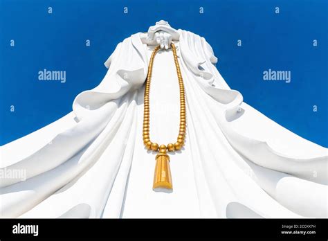 China, Hainan, Sanya, Giant statue of Guanyin of Nanshan holding prayer ...